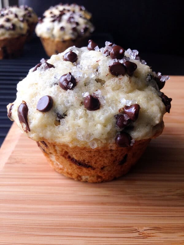Bakery Style Chocolate Chip Muffins. Big, fluffy, buttery & filled with chocolate chips! www.justsotasty.com