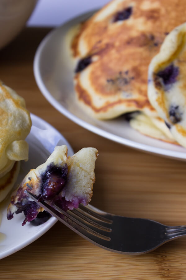 Blueberry Buttmilk Pancakes. Light, fluffy and bursting with blueberries - these pancakes are so much better than any mix! www.justsotasty.com