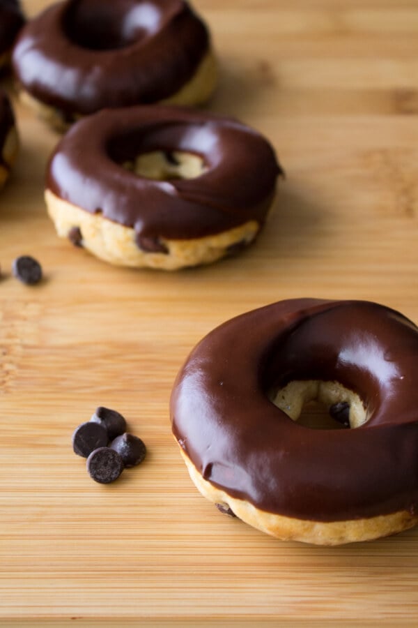 Chocolate Chip Doughnuts. Cake doughnuts baked in a doughnut pan, filled with chocolate chips & dipped in chocolate glaze - Say hello to your new favorite breakfast!