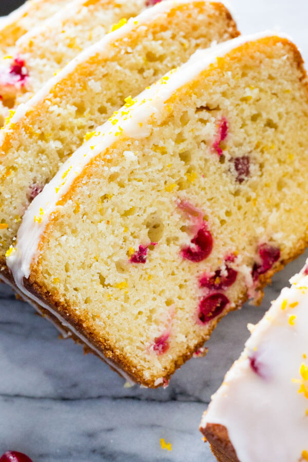 Glazed Cranberry Orange Loaf. Super soft & moist because it's made with sour cream - be sure to include this recipe in your holiday baking check list! www.justsotasty.com