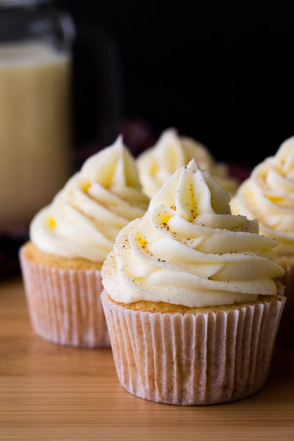 Light & fluffy Eggnog Cupcakes piled high with Eggnog Buttercream. Perfect for a holiday party, or present to yourself! www.justsotasty.com