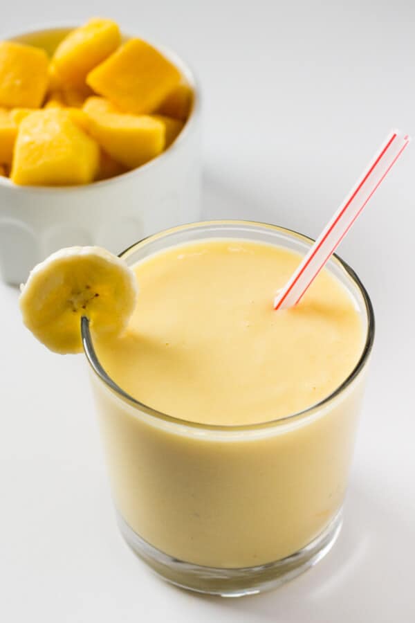 Thick, tropical & full of sunny fruit flavors to brighten even the dreariest of days - Make this Mango Fruit Smoothie for the perfect healthy pick-me up!