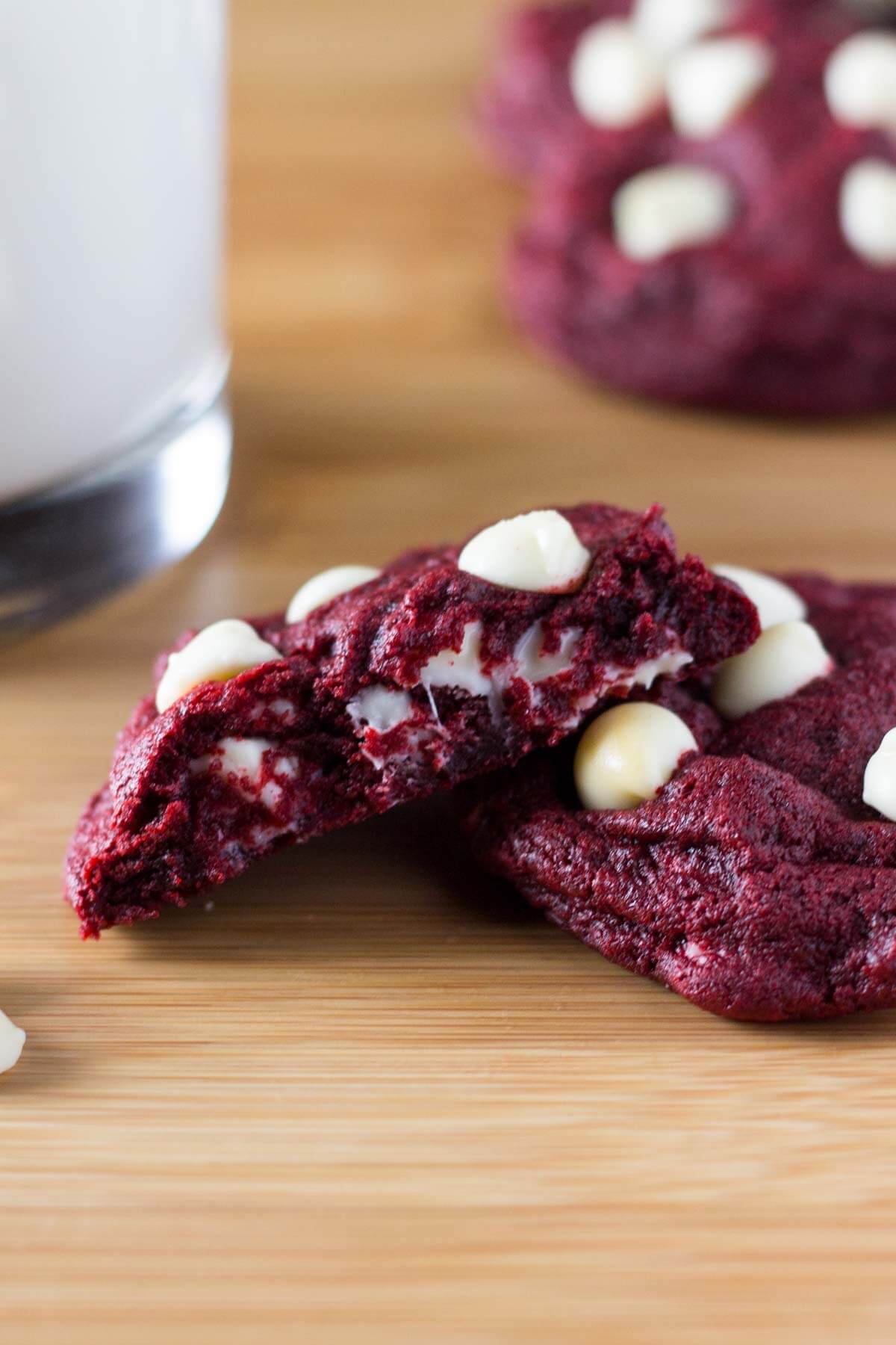 Soft, chewy Red Velvet Chocolate Chip Cookies. With a delicate hint of cocoa & oozing with melted chocolate chips - they're perfectly festive!