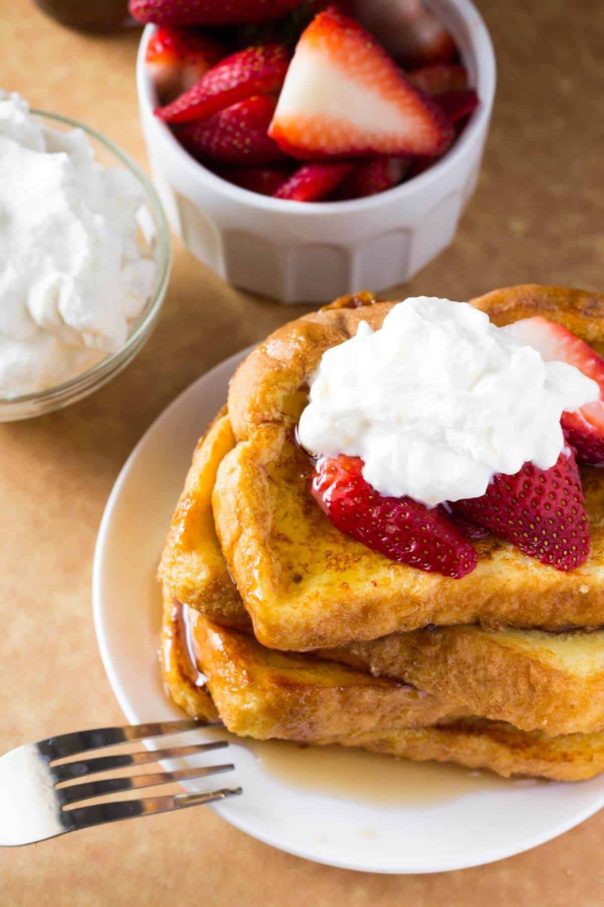 The BEST French Toast - fluffy, buttery, golden brown, topped with maple syrup and the best reason to get out of bed!