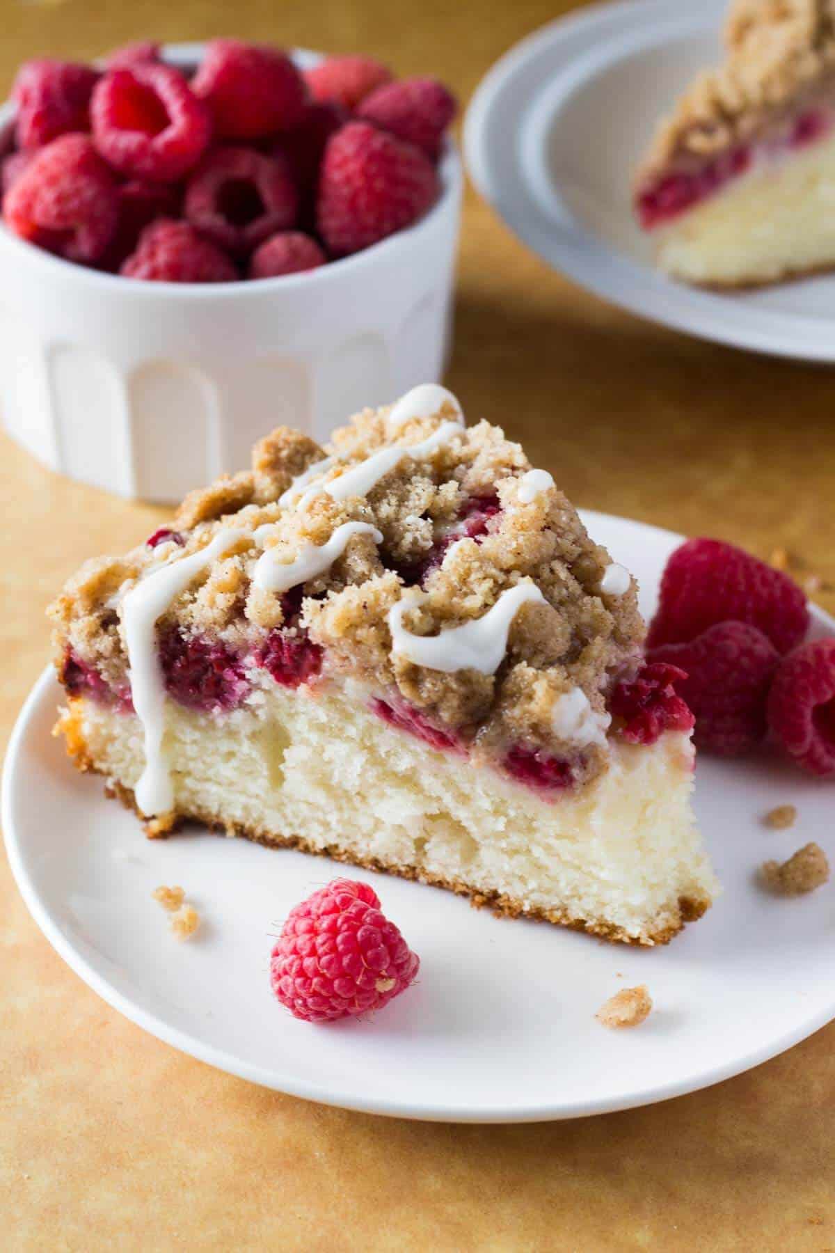 Rich, buttery, perfectly moist Raspberry Coffee Cake with Streusel Topping and Vanilla Glaze! So perfect for breakfast or brunch!
