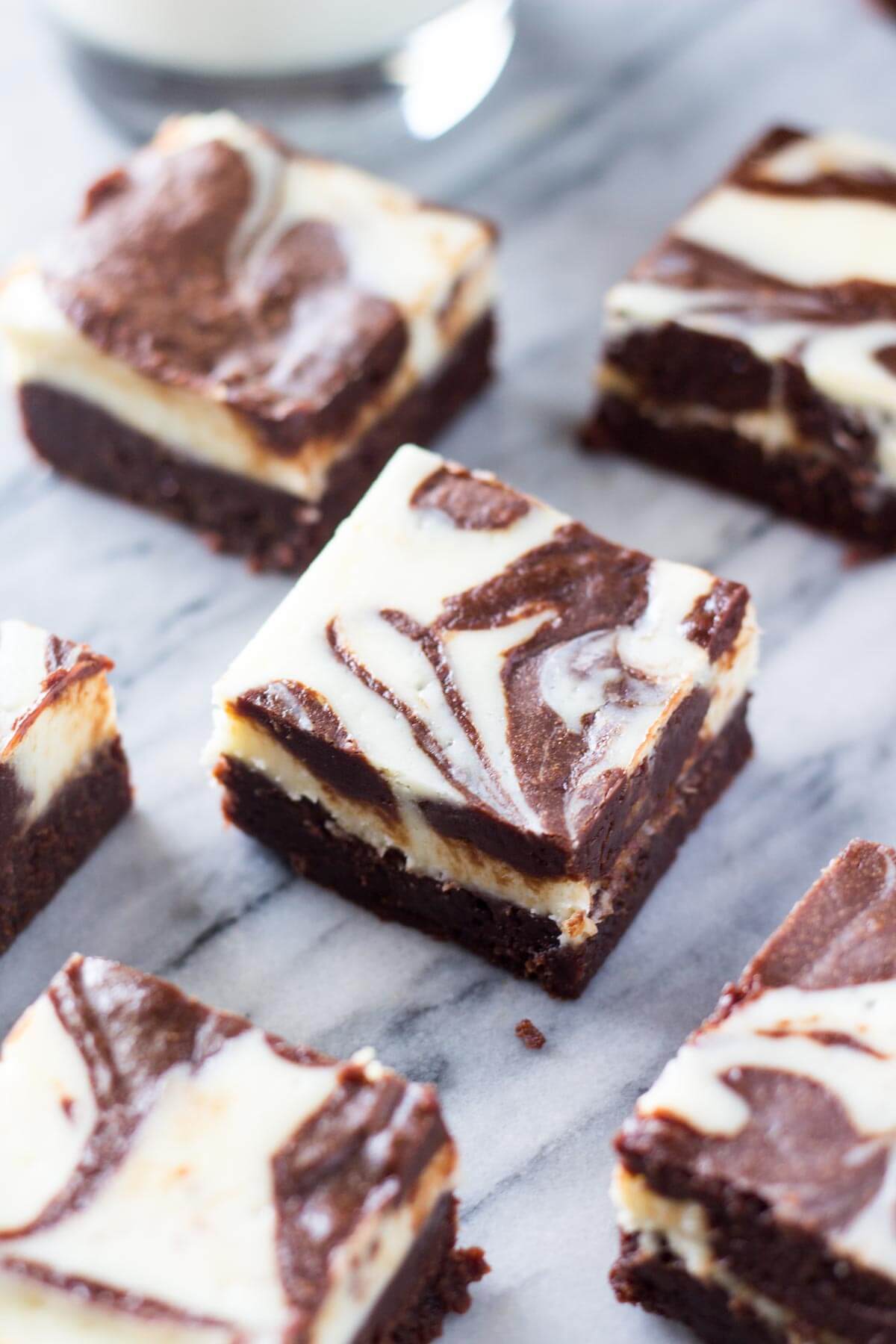 Cream Cheese Brownies - Super fudgy, chocolatey brownies swirled with a layer of classic cheesecake. These are the ULTIMATE dessert!
