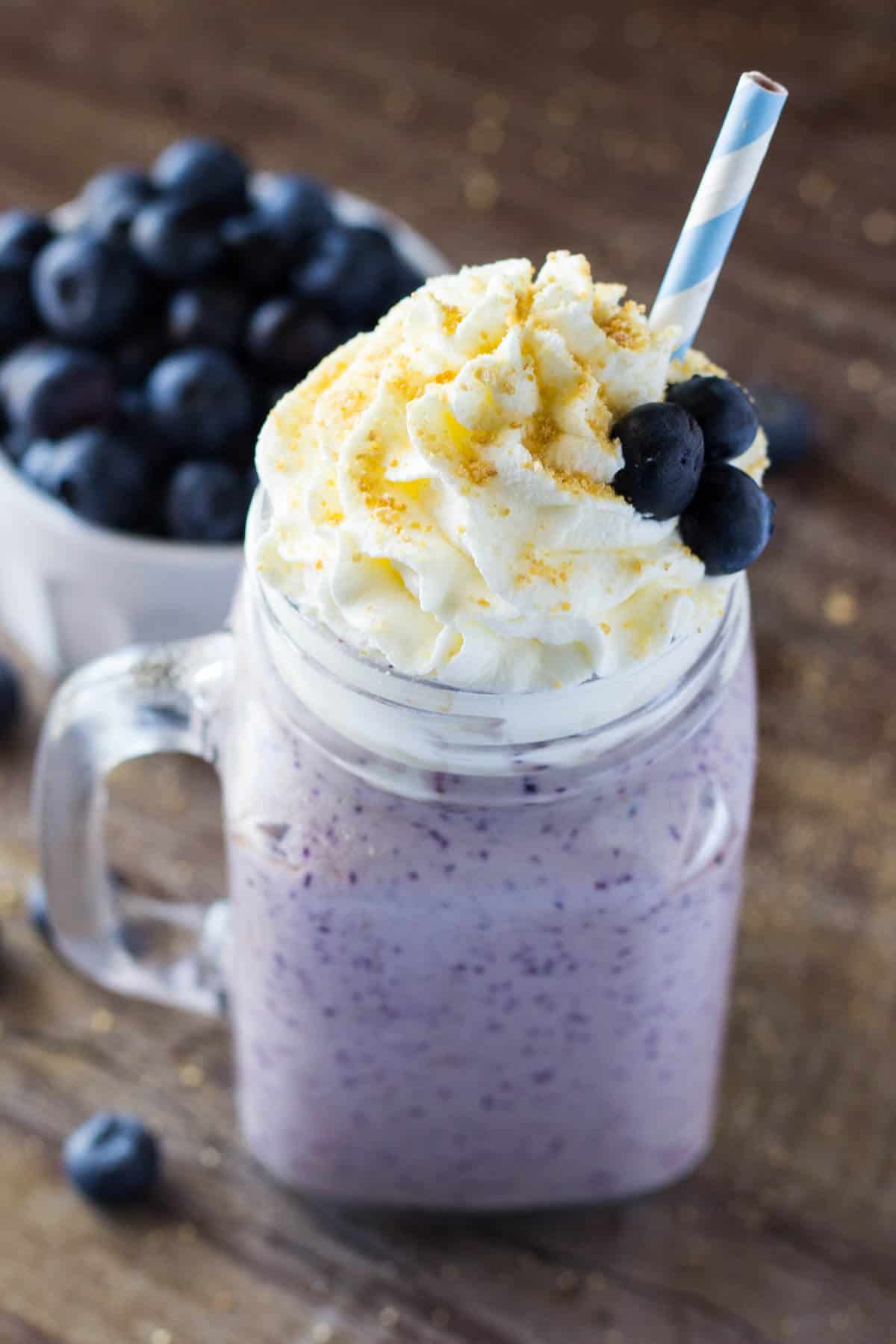 This Blueberry Cheesecake Milkshake has all the flavor of a vanilla milkshake & blueberry cheesecake! Thick, creamy & so decadent - You NEED to make this!