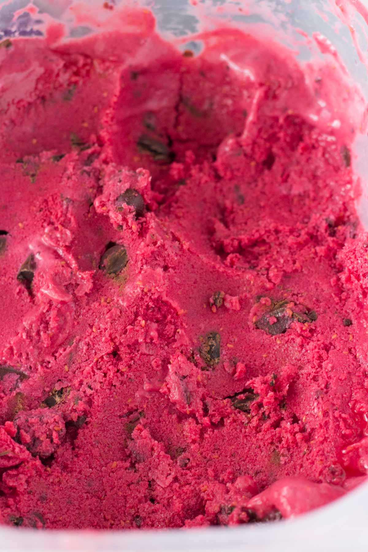 Cold, creamy Dark Chocolate Raspberry Frozen Yogurt. With no refined sugars & made without an ice cream maker, this no-churn frozen yogurt is the perfect way to cool off!