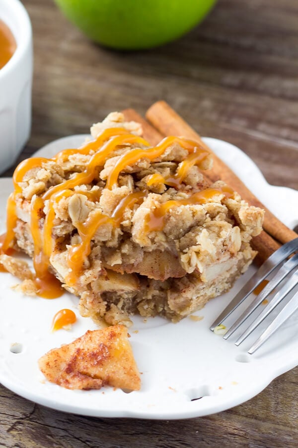 These no-mixer Apple Oatmeal Crumb Bars are perfect for fall. Filled with oatmeal, brown sugar, & cinnamon apples - have them with ice cream & caramel for dessert, then the leftovers for breakfast!