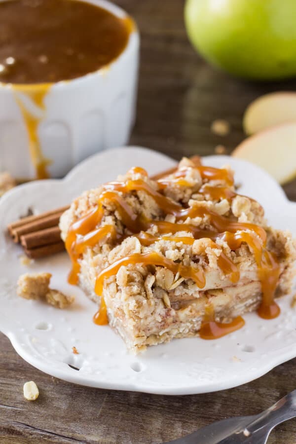These no-mixer Apple Oatmeal Crumb Bars are perfect for fall. Filled with oatmeal, brown sugar, & cinnamon apples - have them with ice cream & caramel for dessert, then the leftovers for breakfast!