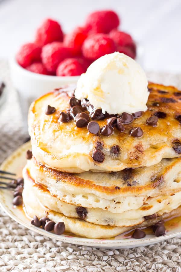 Perfectly stackable, super fluffy Chocolate Chip Pancakes. Made with buttermilk for the perfect flavor & filled with mini chocolate chips. These are delish! www.justsotasty.com