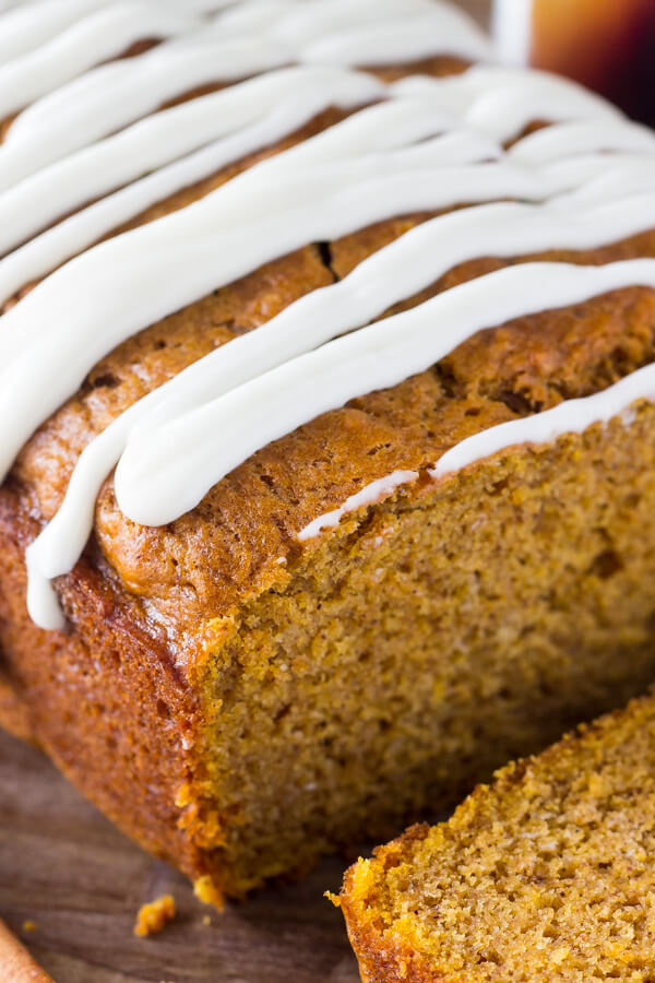 Pumpkin Bread with Cream Cheese Glaze. Soft, moist & filled with vanilla & spices - this pumpkin bread is perfect for fall! www.justsotasty.com