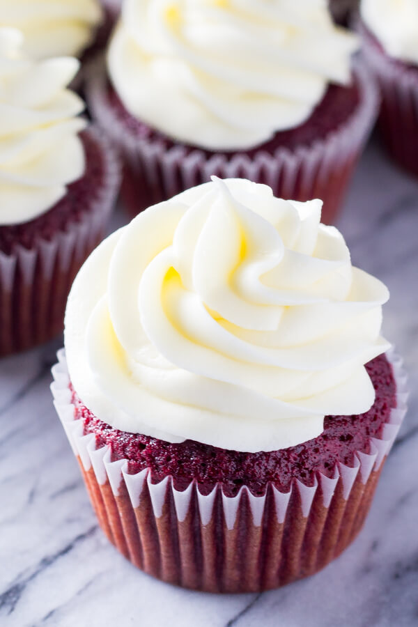 Light & fluffy, perfectly moist Red Velvet Cupcakes topped with tangy cream cheese frosting. The only red velvet recipe you need!