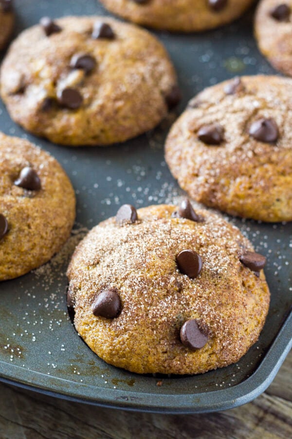 Filled with cinnamon, nutmeg, vanilla, a healthy dose of pumpkin and chocolate chips - these super moist Pumpkin Chocolate Chip Muffins are a must for your fall baking!