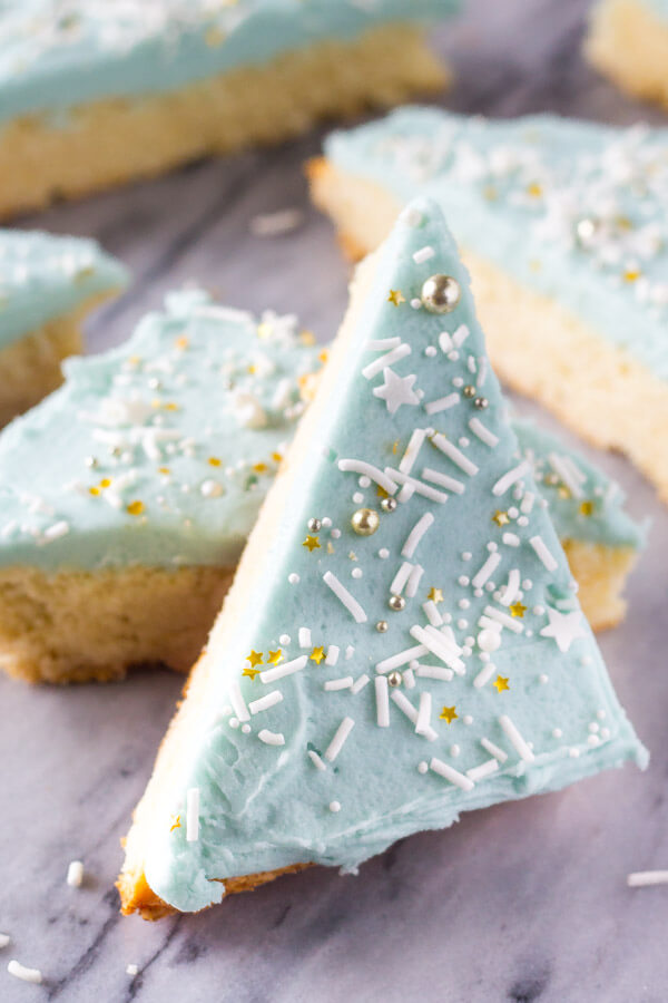 Frosted Sugar Cookie Bars. Super soft and chewy, these Lofthouse style bars melt in your mouth and are so easy to make. www.justsotasty.com