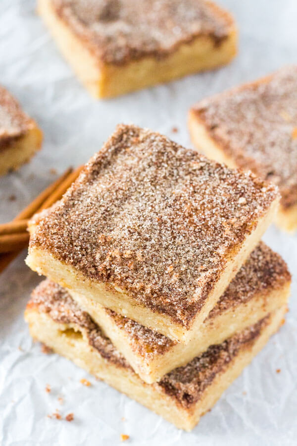 Snickerdoodle Cookie Bars. Soft and chewy with a delicious buttery flavor and crunchy cinnamon sugar topping. No mixer required and way easier than making cookies. www.justsotasty.com