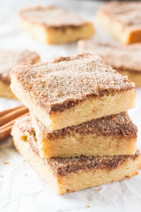 Snickerdoodle Cookie Bars. Soft and chewy with a delicious buttery flavor and crunchy cinnamon sugar topping. No mixer required and way easier than making cookies. www.justsotasty.com