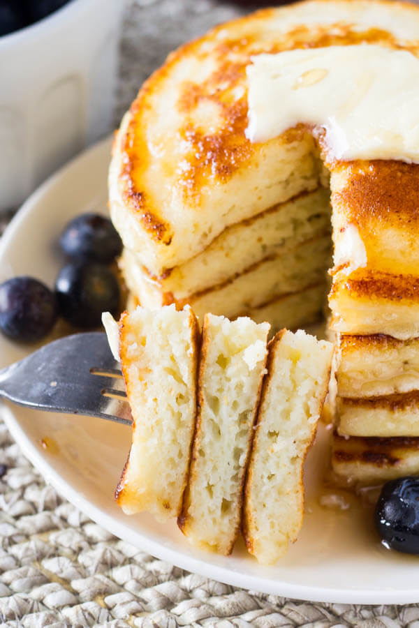 Fluffy Ricotta Pancakes. These ricotta pancakes have a deliciously creamy flavor and the fluffiest texture. They're perfect for creating tall pancake stacks - a the perfect way to make your pancakes extra special. www.justsotasty.com