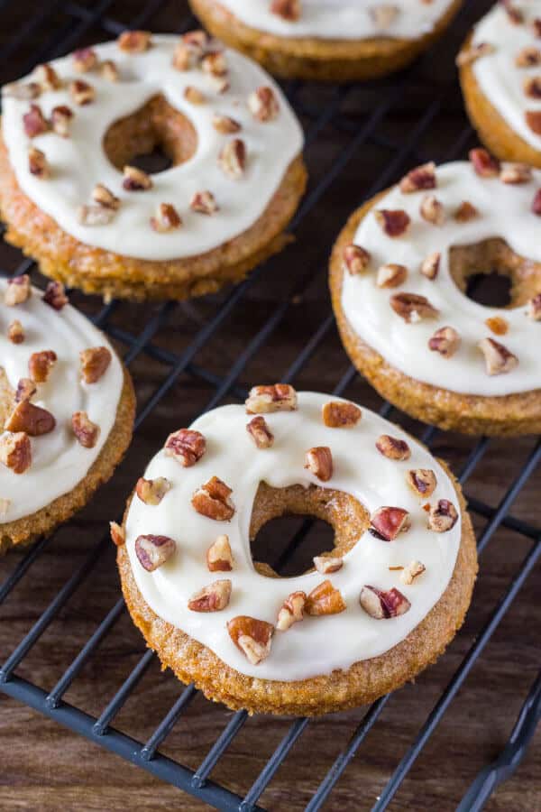 Carrot Cake Doughnuts. These baked doughnuts have all the flavor of your favorite carrot cake with cream cheese frosting in doughnut form. www.justsotasty.com