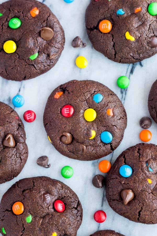M&M Double Chocolate Cookies. Fudgy, chewy, super soft - the perfect M&M chocolate chip cookies for true chocolate lovers! www.justsotasty.com