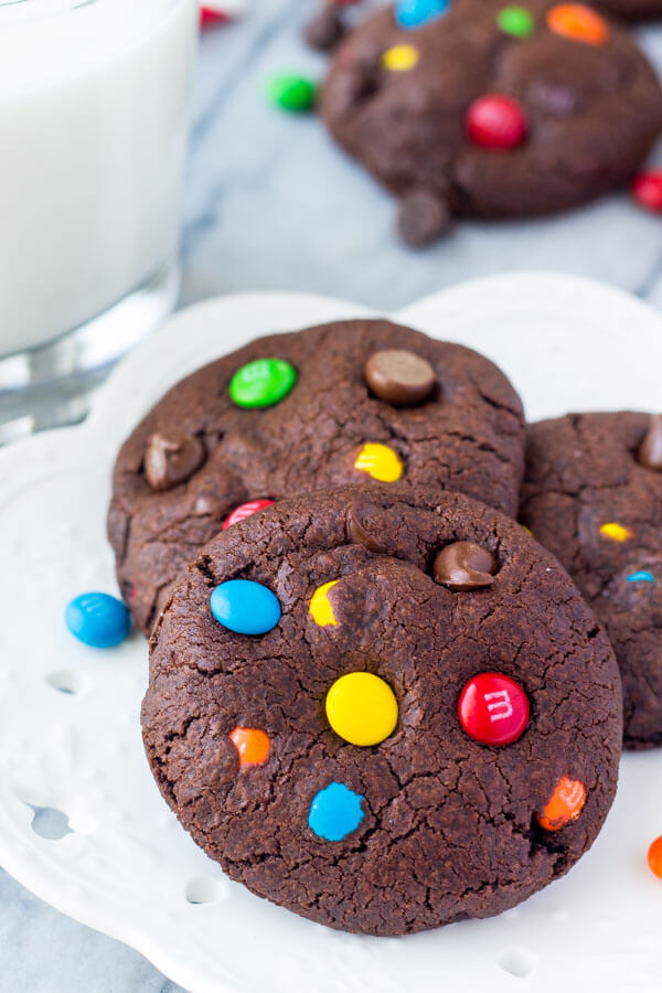 M&M Double Chocolate Cookies. Fudgy, chewy, super soft - the perfect M&M chocolate chip cookies for true chocolate lovers! www.justsotasty.com