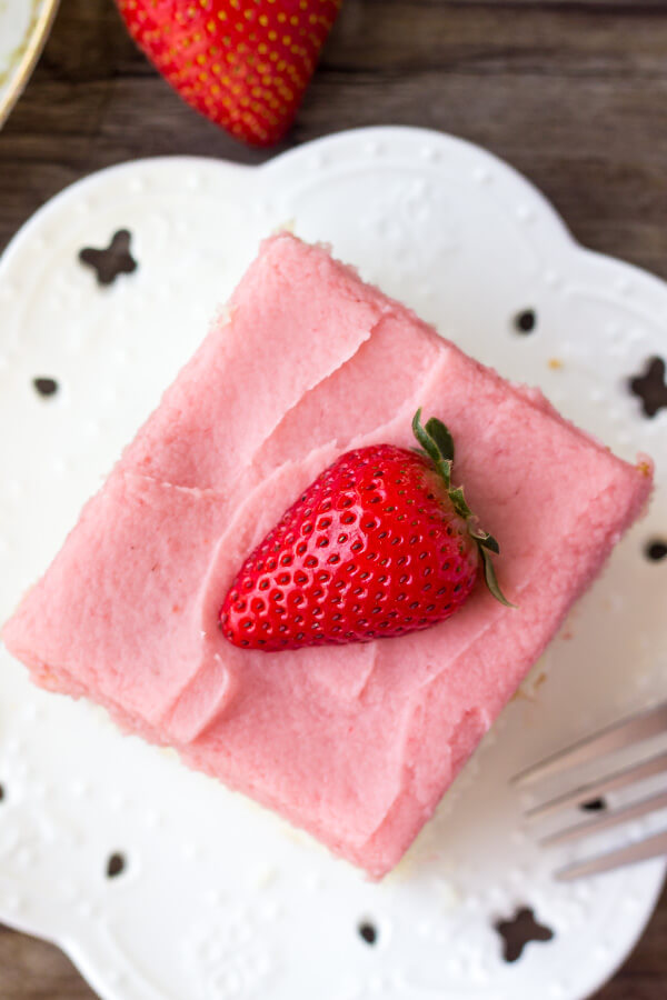 Vanilla Cake with Strawberry Frosting. Fluffy, buttery Vanilla Cake with Strawberry Frosting. You'll love the moist, soft cake crumb & the fresh strawberry flavor of the frosting! www.justsotasty.com
