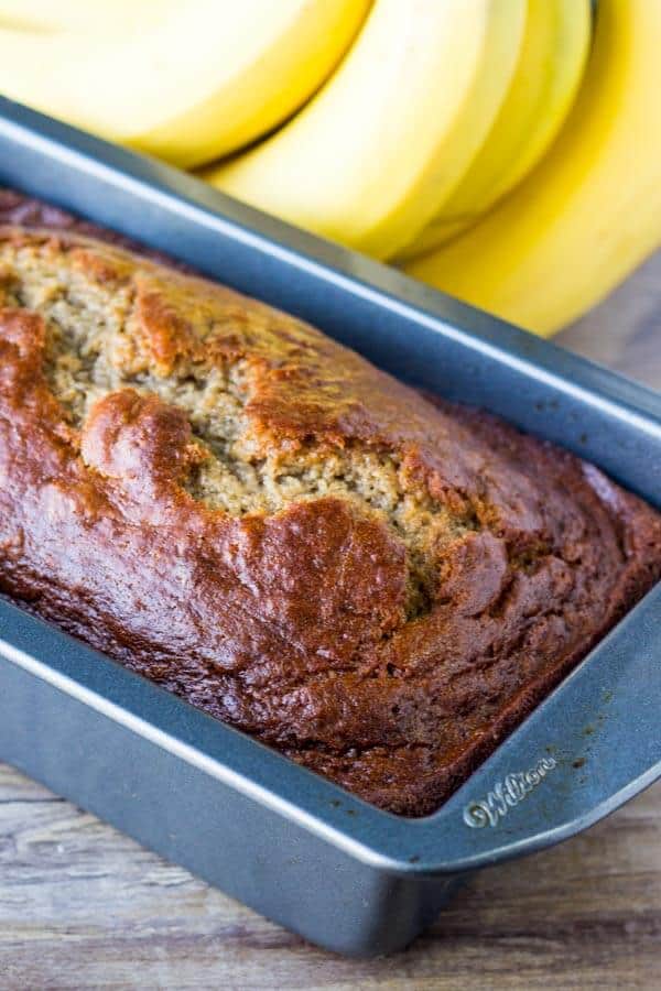 Easy Banana Bread Recipe. This moist banana bread is made with sour cream and is packed with flavor thanks to lots of bananas, cinnamon & vanilla. You'll love this no mixer recipe. www.justsotasty.com