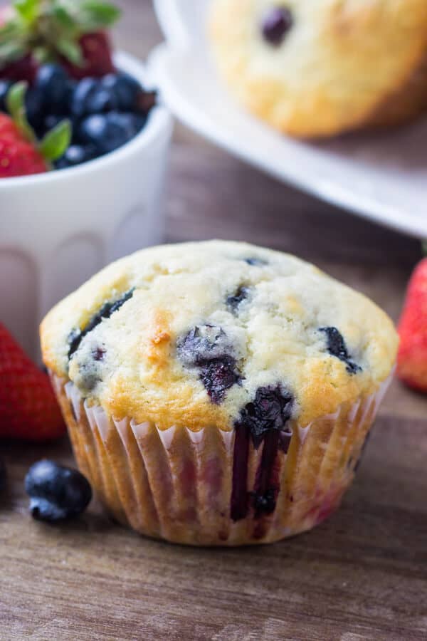 Triple Berry Muffins. Moist, fluffy, buttery & bursting with berries - make them with fresh or frozen fruit - they're always a hit! www.justsotasty.com