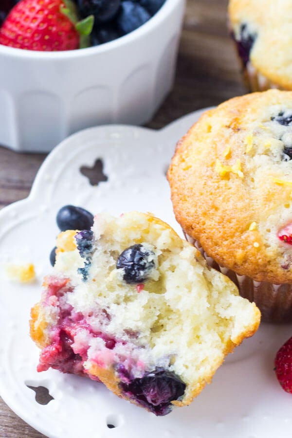 Triple Berry Muffins. Moist, fluffy, buttery & bursting with berries - make them with fresh or frozen fruit - they're always a hit! www.justsotasty.com