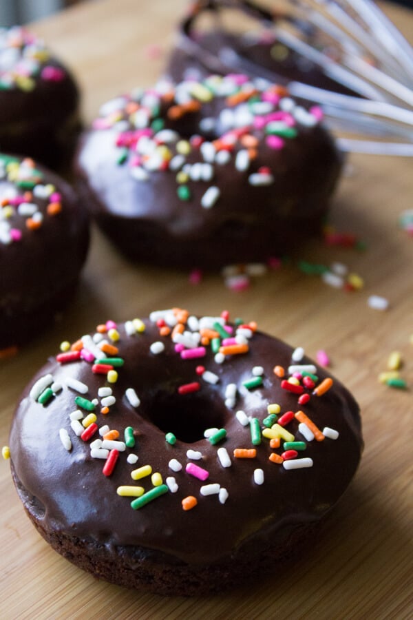 Fudgy, baked double chocolate donuts with a chocolate dip and sprinkles