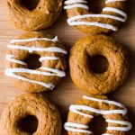 Baked Pumpkin Cake Doughnuts with Cream Cheese Glaze are the perfect fall treat. Ready in 30 minutes from start to finish - try them for breakfast or afternoon coffee!