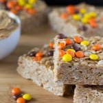Make these super easy & super delicious Peanut Butter Granola Bars. Topped with Reese's Pieces - kids & adults will love these treats.