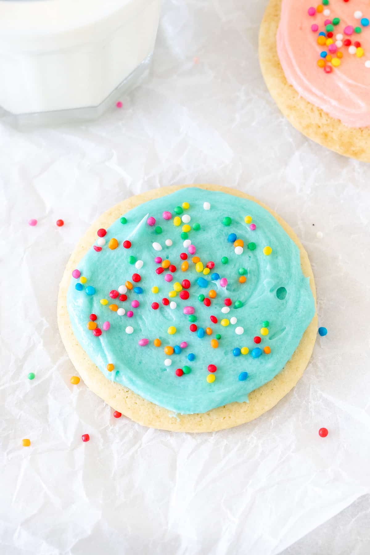 Sour cream sugar cookie with blue frosting and sprinkiles