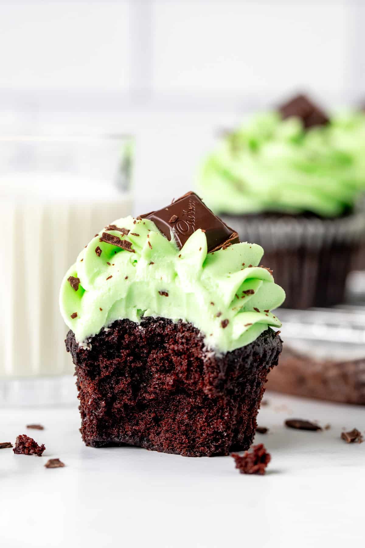 Mint chocolate cupcake with a bite taken out