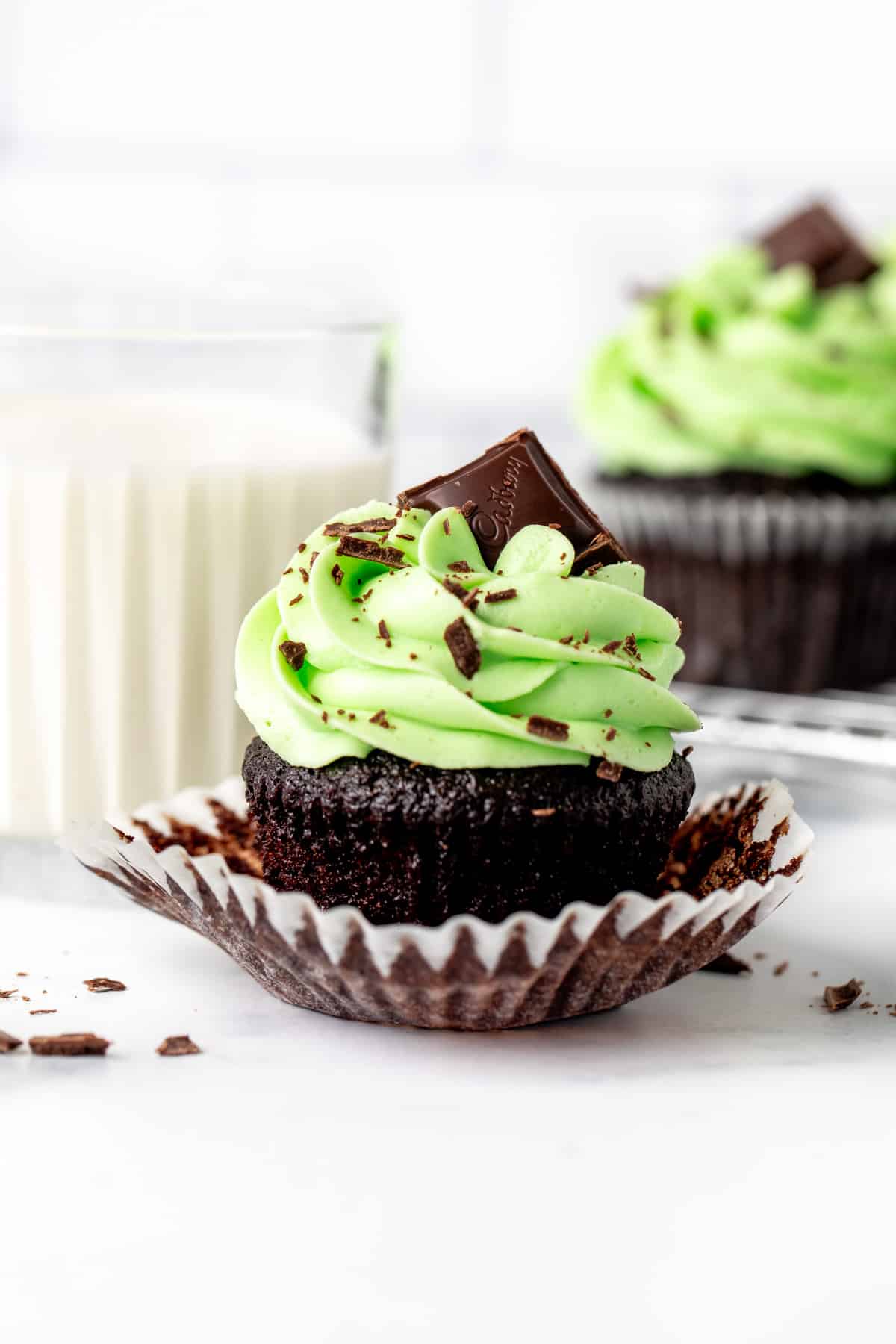 Chocolate cupcake with mint frosting and a square of chocolate on top