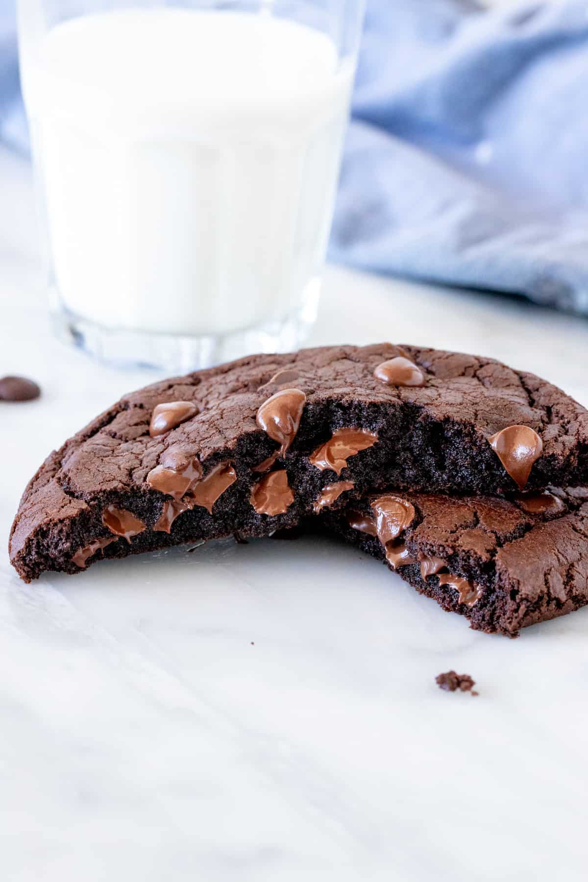 Single serving double chocolate cookie broken in half.