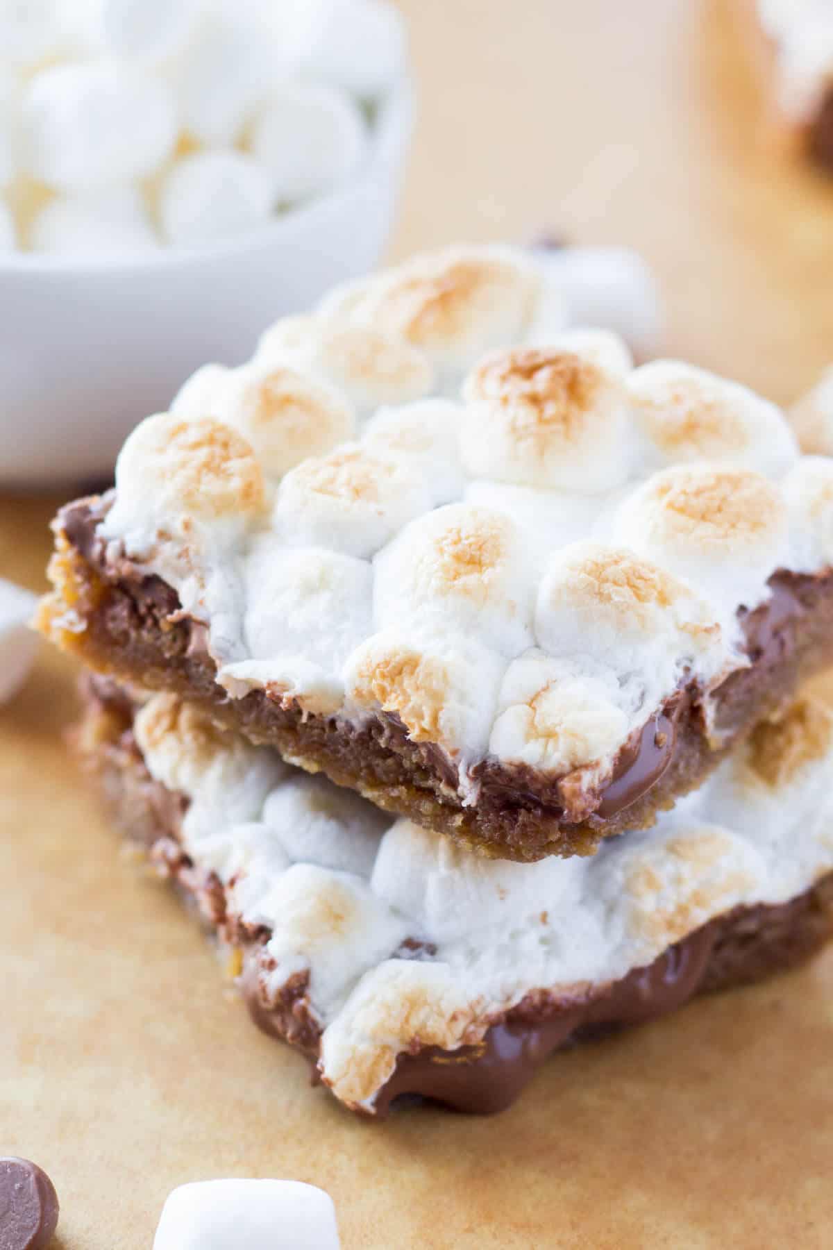 Chewy, gooey, Super Easy S'mores Bars - a blondie-like base, melted milk chocolate & toasted marshmallows come together in these amazing treats! Ready in no time and no mixer required!