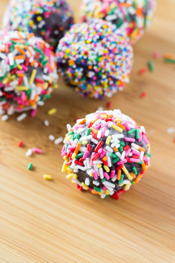 Perfectly fudgy Chocolate Doughnut Holes dipped in sweet vanilla glaze! Fluffy, oh so moist & so much better than the doughnut shop!