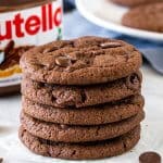 Stack of Nutella cookies with jar of nutella
