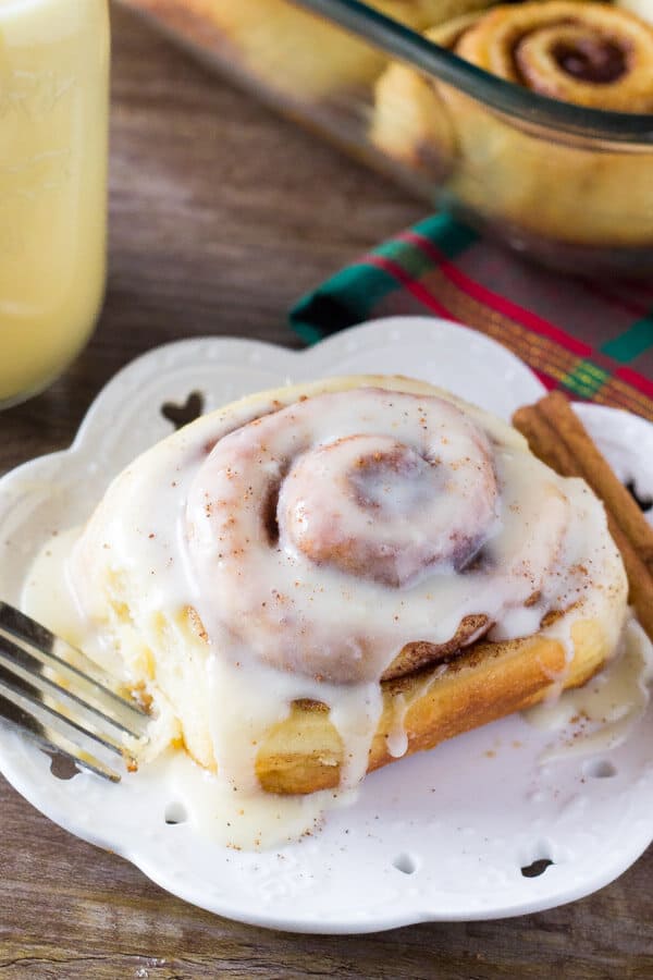 Eggnog Cinnamon Rolls. These super fluffy cinnamon buns are made with eggnog, filled with spices, and drizzled with eggnog glaze. Prepare the buns overnight, then wake up to cinnamon rolls! www.justsotasty.com