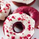 Baked Red Velvet Doughnuts. These moist doughnuts have the perfect cake doughnut crumb, a delicious red velvet flavor & a cream cheese glaze. www.justsotasty.com