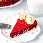 Slice of giant red velvet cookie with cream cheese icing