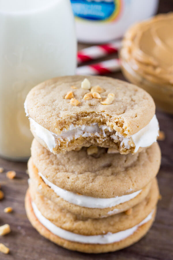 Fluffernutter Cookies. Two soft & chewy peanut butter cookies sandwiched together with fluffy marshmallow frosting. Pure salty-sweet peanut butter bliss! www.justsotasty.com