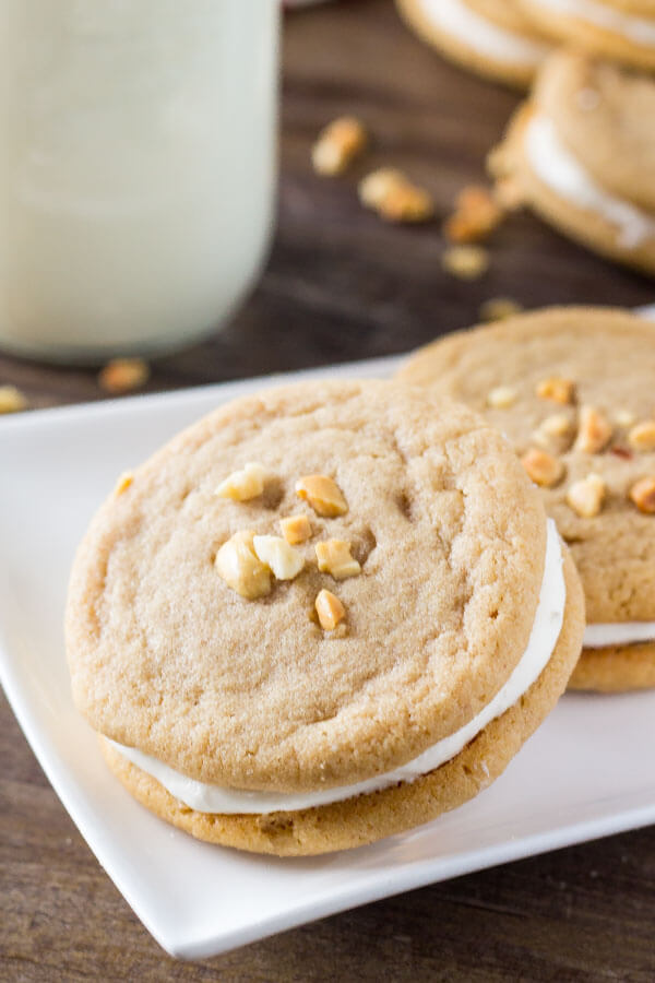 Fluffernutter Cookies. Two soft & chewy peanut butter cookies sandwiched together with fluffy marshmallow frosting. Pure salty-sweet peanut butter bliss! 