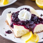 Lemon Blueberry Cheesecake. Smooth & creamy lemon cheesecake with a graham cracker crust and blueberry sauce. Perfect for spring! www.justsotasty.com