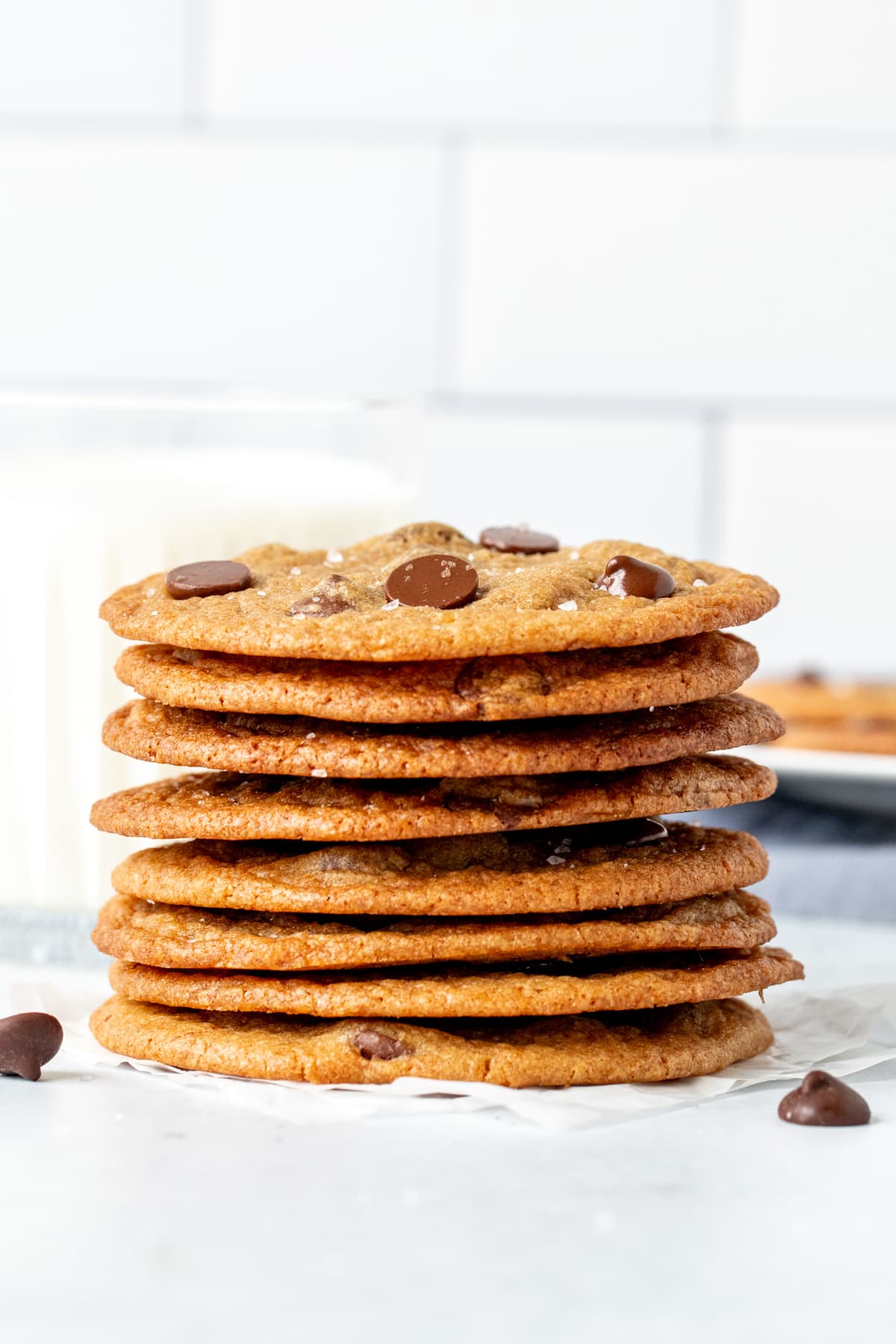 Thin chocolate chip cookies, stacked on top of each other