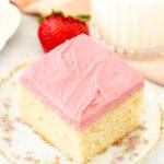 Slice of vanilla cake with strawberry frosting