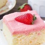 Vanilla Cake with Strawberry Frosting. Fluffy, buttery Vanilla Cake with Strawberry Frosting. You'll love the moist, soft cake crumb & the fresh strawberry flavor of the frosting! www.justsotasty.com