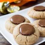 Reese's Peanut Butter Cup Cookies. You only need 4 ingredients & 15 minutes to make these flourless peanut butter cookies. Perfect for peanut butter lovers! www.justsotasty.com