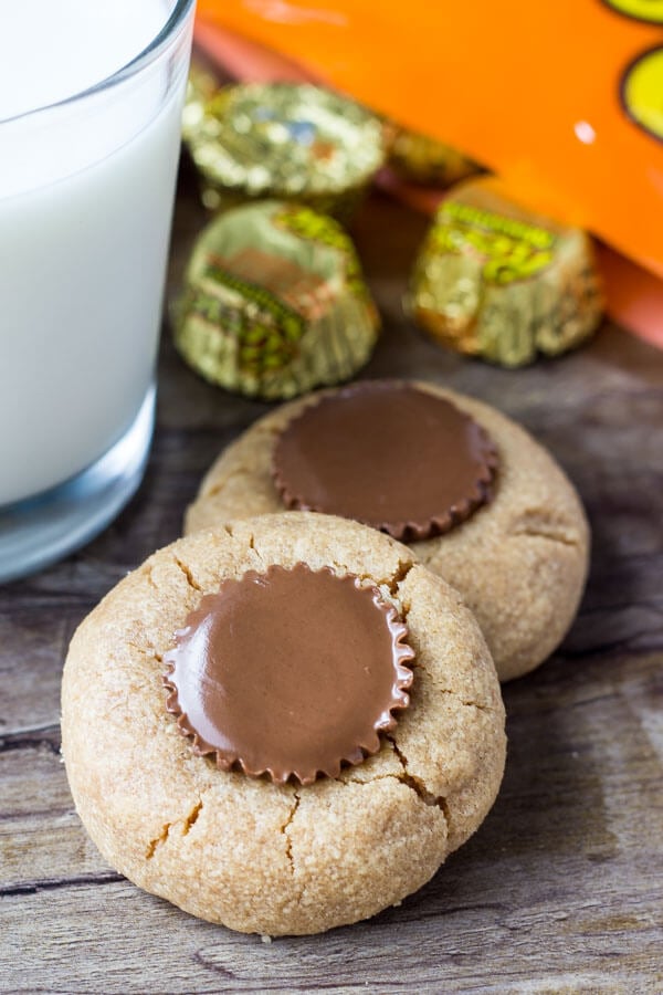 Reese's Peanut Butter Cup Cookies. You only need 4 ingredients & 15 minutes to make these flourless peanut butter cookies. Perfect for peanut butter lovers! www.justsotasty.com
